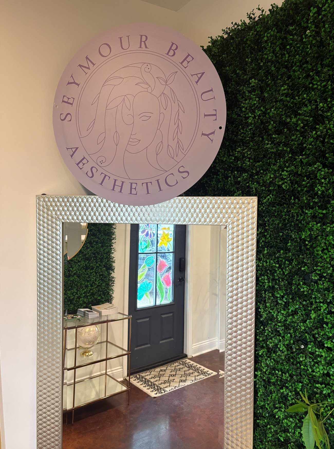 The Seymour Beauty Aesthetics entrance and logo wall in Maurice, Louisiana